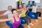 People exercising with resistance bands in gym