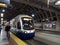 People exit Sound Transit light rail train