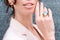 People, fashion, jewelry and luxury concept, closeup of woman wearing luxury jewelry. Color gemstone ring and earrings