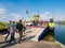 People and ferry leaving Tiengemeten island in Haringvliet estuary, Netherlands