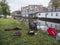 People fish on the embankment of canal boterdiep in the old city of groningen