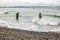 People fishing on danish shore of Oresund, outside the Kronborg castle