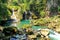 People fishing in Semuc champey natural pool, waterfall and rocks from riverside