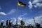 People and flag waving on the top of the Union of Lublin Mound in Lviv, Ukraine