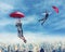 People flying in the sky with umbrellas