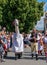 People in folk costumes in a procession with a horse mask