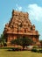 People in front of the ornamental tower in the ancient Brihadisvara Temple in Thanjavur, india.