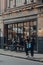 People in front of the Wine Merchant store in Borough Market, London, UK