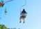 People on funicular cable chair above Capri Island