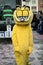 People with garfield cat costume parading in the street