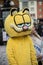 People with garfield cat costume parading in the street