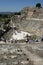 People gather amongst the Roman theatre ruins at the ancient site of Ephesus in Turkey.