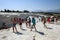 People gather around the thermal pools at the travertines, or Cotton Castle, at Pamukkale in Turkey.
