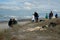 People gather on beach to view aftermath of Rena d