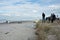 People gather on beach to view aftermath of Rena d