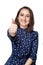 People, gesture, style and fashion concept - happy young woman or teen girl in casual clothes showing thumbs up