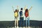 People, girls and man with victory gesture on mountain top