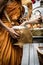 People give alms food and item offering to Buddhist monk