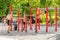 People go in for sports and fitness on a special equipped gym outdoors in city park,