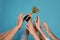 People with gold trophy cup on blue background