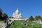 People on grass near Basilica of the Sacred Heart of Paris on Montmartre