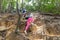 People Group With Backpacks Climb Mountain Trekking On Forest Path Back Rear View, Young Men And Woman On Hike