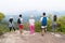 People Group With Backpacks Standing On Mountain Top Enjoy Landscape Back Rear View, Young Men And Woman