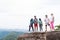 People Group With Backpacks Standing On Mountain Top Enjoy Landscape Talking, Young Men And Woman