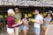 People Group Buying Bananas On Street Traditional Market, Young Man And Woman Travelers