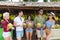 People Group Drink Coconut Cocktail On Street Traditional Fruits Market