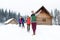 People Group Near Wooden Country House Winter Snow Resort Cottage