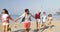 People Group Running On Beach Three Couples Holding Hands Happy Cheerful Men And Women Tourists On Vacation