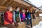 People Group Sitting On Terrace Wooden Country House Winter Snow Resort Cottage