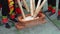 people hammering glutinous rice with wooden sticks for making rice cakes with characteristics of Guangxi Zhuang nationality