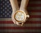 People hand holding cup of coffe with 4th of July message