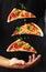 People Hand Taking Three Slices of pizza . Pizza and food concept. Close up focus on middle pizza. Outdoor party