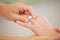 People, hands and wedding ring for marriage, love or commitment together in promise at ceremony. Closeup of married