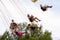 People have fun at the carousel flying swing ride attraction at Tibidabo Amusement Park