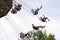 People have fun at the carousel flying swing ride attraction at Tibidabo Amusement Park