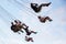 People have fun at the carousel flying swing ride attraction at Tibidabo Amusement Park