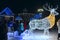 People have a rest in park with festive Christmas garlands in shape of deer