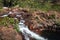 People having drinks and relaxing in the water. Waterfalls and natural pools at Buley rockholes, Litchfield national park,