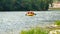 People having fun or doing sport on rubber on the river rafting