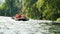 People having fun or doing sport on rubber on the river rafting