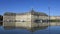 People having fun in a mirror fountain in front of Place de la Bourse in Bordeaux, France