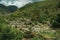 People having fun in public fluvial pool amid hilly landscape