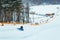 people having fun. snow tubing down by winter hill