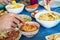 People having some appetizers on a colorful table