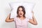 People and healthy sleep concept. Pretty young Caucasian woman embraces white soft pillow, closes eyes and slumbs at afternoon, re