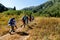 People hike in mountains